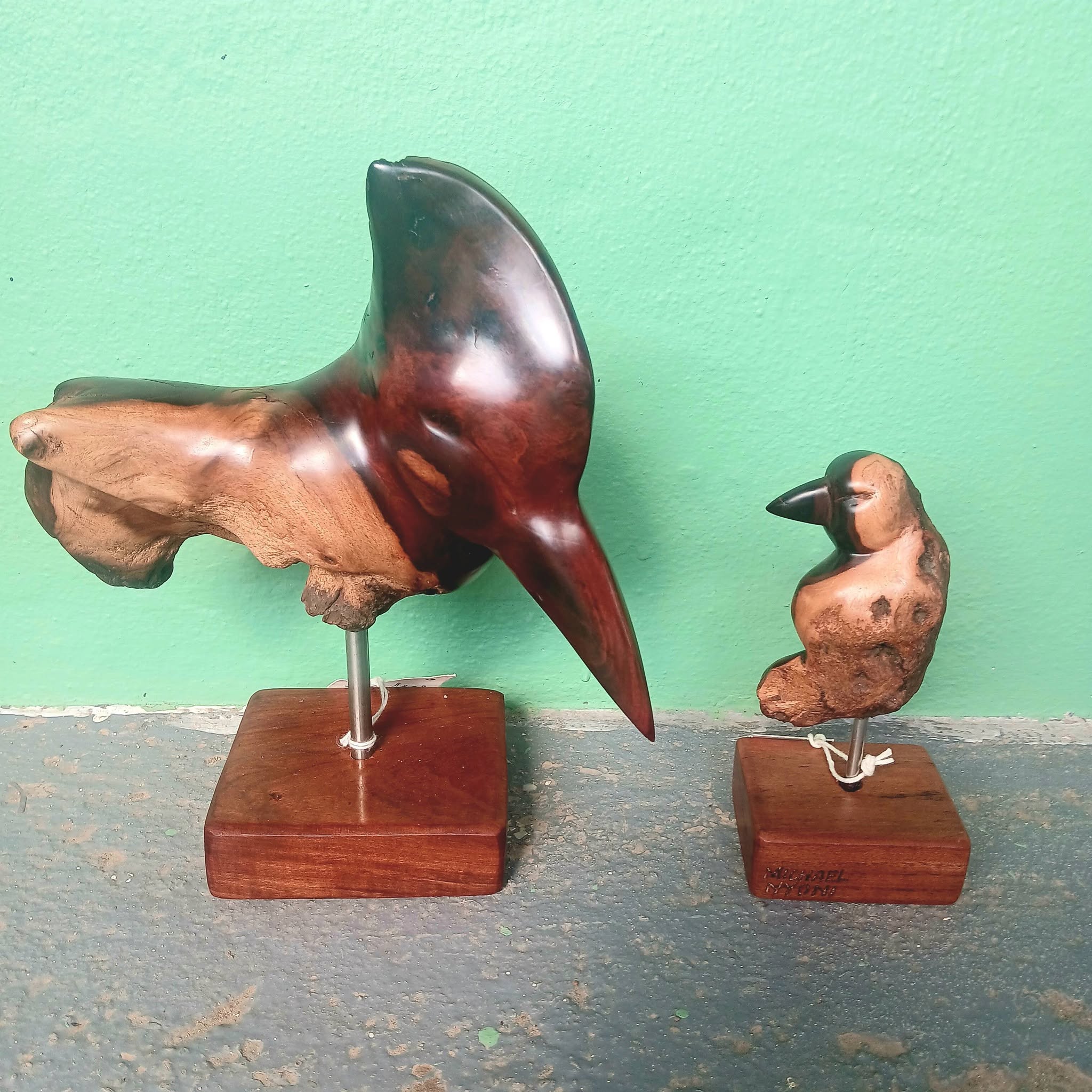 Hand-carved wooden bird sculptures by Michael Nyoni