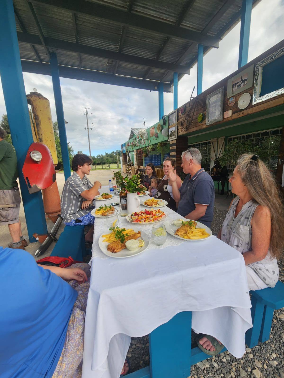 Guests enjoying fish and chips on the patio
